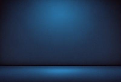 The primary subject of the image is a blue wall with a blue light shining on it. The setting is a dark room, and the visual style is a photo. The dominant colors and overall atmosphere are blue and dark, creating a moody and mysterious ambiance.