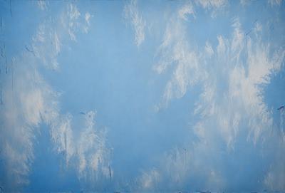 The primary subject of the image is a blue sky with clouds. The setting is a cloudy blue sky, and the visual style is a photo. The dominant colors are blue and white, creating a calm and serene atmosphere.