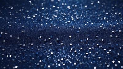 The primary subject of the image is a blue background with a pattern of white stars. The setting appears to be a night sky, and the visual style is a close-up of the blue fabric with the white stars. The colors and mood of the image are predominantly blue and starry, creating a serene and celestial atmosphere.