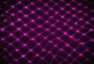 The primary subject of the image is a purple background with a pattern of pink dots. The setting is a dark background, which contrasts with the bright pink dots. The visual style is a combination of digital art and illustration, creating a unique and eye-catching design. The colors and mood of the image are predominantly pink and purple, giving it a vibrant and lively atmosphere.