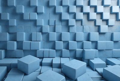 The primary subject of the image is a blue wall with a pattern of blue and white blocks. The setting is a room with a blue wall, and the visual style is a photo. The dominant colors are blue and white, creating a calm and soothing atmosphere.