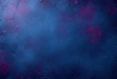 The primary subject of the image is a large, purple, blue, and pink painting. The setting is a canvas, and the visual style is a painting. The dominant colors in the painting are purple, blue, and pink, creating a vibrant and lively atmosphere.