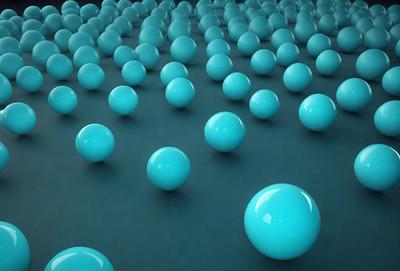 The primary subject of the image is a large number of blue spheres arranged in a pattern. The setting is a dark blue background, which contrasts with the bright blue spheres. The visual style is a digital art or illustration, creating a unique and eye-catching pattern. The colors and mood of the image are predominantly blue, giving it a calm and serene atmosphere.