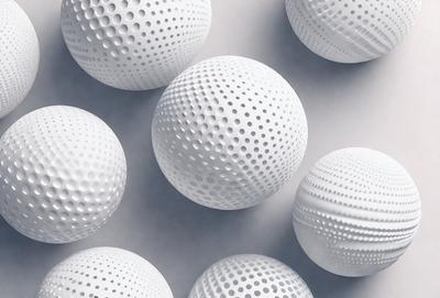 The primary subject of the image is a collection of white balls with a patterned surface. The balls are arranged in a visually appealing manner, creating an interesting and eye-catching display. The setting is a white background, which provides a clean and minimalist look to the scene. The visual style of the image is a combination of photo and digital art, as the balls appear to be a mix of real-life objects and computer-generated patterns. The colors and mood of the image are predominantly white, giving it a
