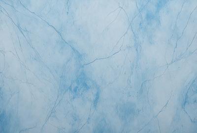 The primary subject of the image is a blue marble wall with a white background. The visual style appears to be a photo of the wall, showcasing its unique texture and design. The colors and mood of the image are predominantly blue and white, creating a calm and serene atmosphere.
