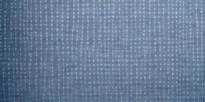 The primary subject of the image is a blue and white patterned fabric. The setting is a close-up of the fabric, showcasing its intricate design. The visual style is a detailed, up-close view of the pattern. The dominant colors are blue and white, creating a calm and soothing atmosphere.