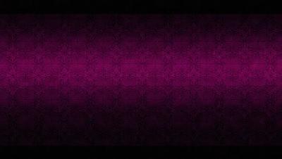 The primary subject of the image is a purple wall with a patterned design. The setting is a room with a purple wall as the main focus. The visual style is a patterned wallpaper, which gives the room a unique and artistic atmosphere. The dominant colors are purple and pink, creating a warm and inviting mood.