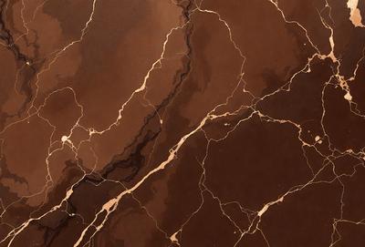 The primary subject of the image is a marble surface with a brown and gold color palette. The setting is a close-up of the marble, showcasing its intricate patterns and textures. The visual style is a realistic representation of the marble, capturing its natural beauty. The colors and mood of the image are warm and earthy, evoking a sense of luxury and sophistication.