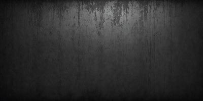The primary subject of the image is a black and white photo of a wall. The setting is a room with a black wall, and the visual style is a black and white photograph. The dominant colors are black and white, creating a moody atmosphere.