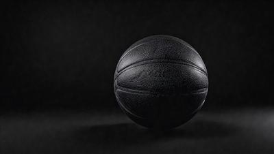 Primary subject: Basketball
Setting/background: Black background
Visual style: Photo
Colors and mood: Black and white