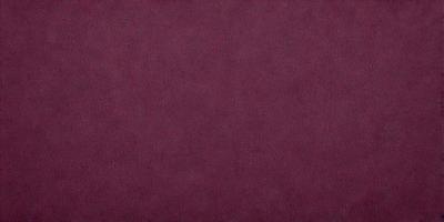 The primary subject of the image is a large, purple surface. The setting is a dark room, and the visual style appears to be a photo. The dominant colors are purple and red, creating a moody atmosphere.