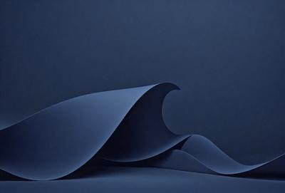 The primary subject of the image is a large, blue, curved wave. The setting is a dark blue background, which creates a dramatic contrast with the wave. The visual style is a combination of digital art and illustration, giving the image a modern and artistic appearance. The dominant colors are blue and black, creating a moody and dramatic atmosphere.
