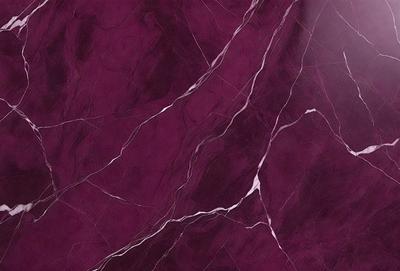 The primary subject of the image is a marble wall with a purple hue. The setting is a room with a purple marble wall, which serves as the background. The visual style is a close-up of the marble wall, showcasing its texture and color. The colors and mood of the image are predominantly purple, creating a calm and elegant atmosphere.