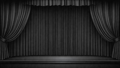 The primary subject of the image is a black curtain, which is the main object in the scene. The setting is a stage, with the curtain hanging in front of it. The visual style of the image is a black and white photo, giving it a classic and timeless appearance. The colors and mood of the image are predominantly dark and dramatic, creating a sense of mystery and intrigue.