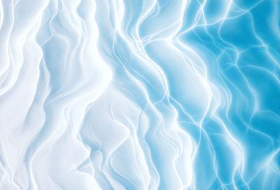The primary subject of the image is a white and blue swirl pattern. The setting is a blue background, and the visual style appears to be a digital art or illustration. The dominant colors are white and blue, creating a calm and soothing atmosphere.