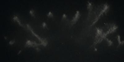 The primary subject of the image is a handprint, which is a drawing of a hand. The handprint is set against a dark background, creating a contrasting visual effect. The drawing appears to be a digital art or illustration, as it is not a photo or a clipart. The overall atmosphere of the image is somewhat mysterious and intriguing, as the handprint stands out against the dark background.