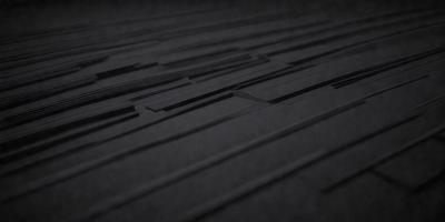 The primary subject of the image is a black and white pattern, which appears to be a close-up of a black and white tile floor. The setting is a dark room, and the visual style is a black and white photo. The colors and mood of the image are predominantly dark and moody, with the black and white pattern creating a sense of depth and contrast.