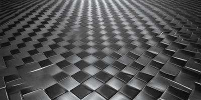 The primary subject of the image is a patterned surface, which appears to be a metal or a textured material. The setting is a black and white background, which adds a sense of depth and contrast to the image. The visual style is a close-up of the patterned surface, showcasing the intricate details of the design. The colors and mood of the image are predominantly black and white, giving it a classic and timeless feel.