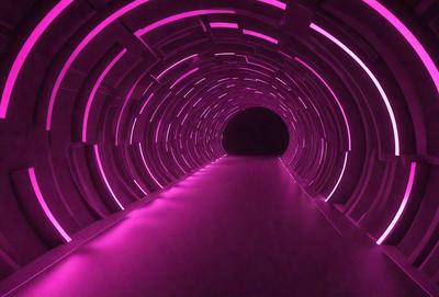 The primary subject of the image is a tunnel with a purple lighting effect. The setting is a dark tunnel with a pink glow, creating a unique and visually striking atmosphere. The visual style appears to be a combination of a photo and digital art, as the tunnel appears to be a digital creation with a purple lighting effect. The colors and mood of the image are predominantly purple, giving it a futuristic and surreal appearance.