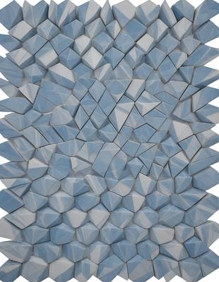 The primary subject of the image is a large, intricate, and colorful pattern made up of many small blue squares. The pattern is displayed on a white background, creating a striking contrast between the blue squares and the white surface. The visual style of the image is a combination of digital art and illustration, as the pattern appears to be a digital creation or a hand-drawn illustration. The colors and mood of the image are predominantly blue, with a sense of depth and complexity in the pattern.