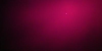 The primary subject of the image is a pink background, which creates a unique and eye-catching visual effect. The setting or background is a dark, pink-colored sky, which contrasts with the bright pink hue of the background. The visual style of the image is a combination of a photo and digital art, as it appears to be a photo with a pink background, but the background itself is a digital creation. The colors and mood of the image are predominantly pink, giving it a warm