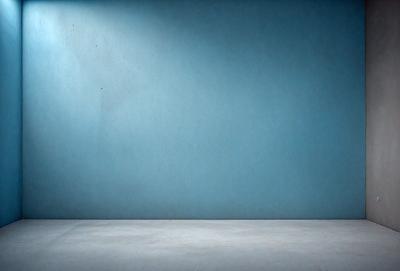 The primary subject of the image is a blue wall. The setting is a room with a blue wall, and the visual style is a photo. The dominant colors are blue, and the overall atmosphere is calm and serene.