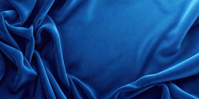 The primary subject of the image is a blue cloth, which is the main object, scene, or focus of the image. The setting or background is a blue curtain, and the visual style is a photo. The dominant colors and overall atmosphere are blue and calm.