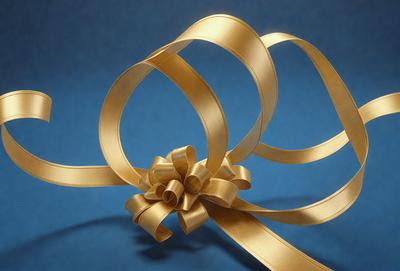 The primary subject of the image is a gold bow, which is the main object, scene, or focus of the image. The setting is a blue background, and the visual style is a photo. The colors and mood of the image are predominantly gold and warm, creating a sense of elegance and sophistication.