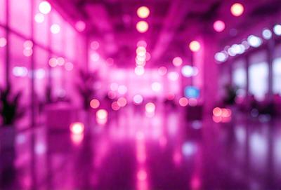 The primary subject of the image is a large, brightly lit room with a pinkish hue. The setting is a hallway with a row of lights on the ceiling, creating a warm and inviting atmosphere. The visual style is a combination of a photo and digital art, giving the image a unique and artistic appearance. The dominant colors are pink and purple, with the pinkish hue creating a sense of warmth and comfort.