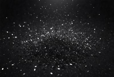 The primary subject of the image is a close-up of a black and white photo of a sparkling, glittering substance. The setting is a dark background, which contrasts with the bright, shiny substance. The visual style is a black and white photo, giving it a classic and timeless appearance. The colors and mood of the image are predominantly black and white, with the glittering substance being the focal point and creating a sense of depth and texture.