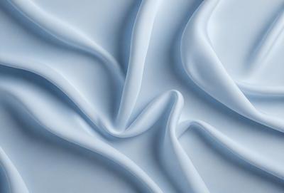 The primary subject of the image is a white sheet of fabric, which is the main object, scene, or focus of the image. The setting is a white background, which provides a clean and minimalistic environment. The visual style is a close-up of the fabric, showcasing its texture and details. The colors and mood of the image are predominantly white, giving it a clean, simple, and elegant appearance.