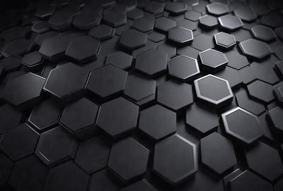 The primary subject of the image is a black and white patterned surface, which appears to be a wall or a floor. The setting is a dark room, and the visual style is a close-up of the pattern. The dominant colors are black and white, creating a moody and dramatic atmosphere.