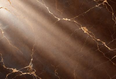 The primary subject of the image is a marble surface with a sunlight shining on it. The setting is a room with a brown marble wall, and the visual style is a photo. The colors and mood of the image are warm and inviting, with the sunlight creating a cozy atmosphere.