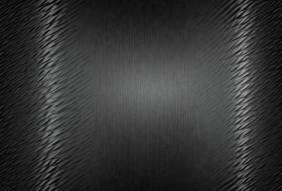 The primary subject of the image is a black background with a pattern of white lines. The setting is a dark room, and the visual style is a close-up of the pattern. The colors and mood are predominantly dark and moody, with the white lines providing a contrasting element.