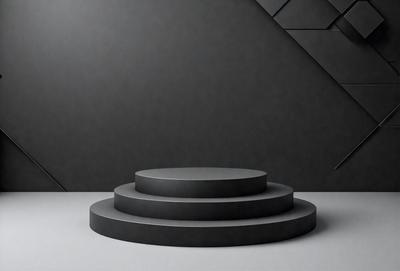 The primary subject of the image is a black and white photo of a stack of three black circles. The setting is a black background, which creates a striking contrast with the circles. The visual style is a black and white photo, giving the image a classic and timeless appearance. The colors and mood of the image are predominantly black and white, with a sense of simplicity and elegance.