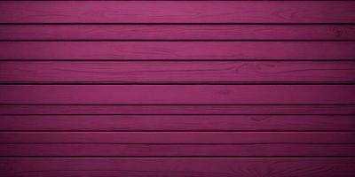 The primary subject of the image is a wooden wall with a purple hue. The setting is a room with a wooden surface, and the visual style appears to be a photo. The dominant colors are purple and brown, creating a warm and inviting atmosphere.