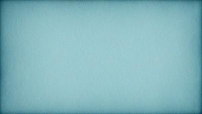 The primary subject of the image is a blue background. The setting is a large, empty space with no visible objects or people. The visual style is a close-up of the blue background, which gives a sense of depth and focus to the image. The colors and mood are predominantly blue, creating a calm and serene atmosphere.