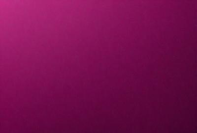 The primary subject of the image is a large, purple wall. The setting is a room with a purple background, and the visual style is a close-up of the wall. The colors and mood of the image are predominantly purple, creating a calm and serene atmosphere.