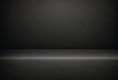 The primary subject of the image is a black background. The setting is a dark room, and the visual style is a black and white photo. The colors and mood of the image are predominantly dark and moody, with a sense of mystery and depth.