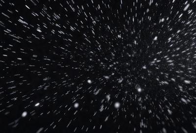 The primary subject of the image is a black background with a white star field. The setting is a night sky, and the visual style is a photo. The colors and mood are predominantly dark and moody, with the white stars providing a contrasting element.