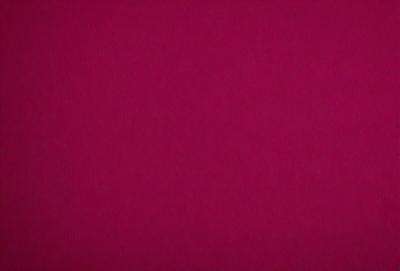 The primary subject of the image is a large, pink surface. The setting is a dark background, which contrasts with the bright pink color of the surface. The visual style appears to be a close-up of the pink surface, possibly a photo or a digital art piece. The colors and mood of the image are predominantly pink, creating a warm and vibrant atmosphere.