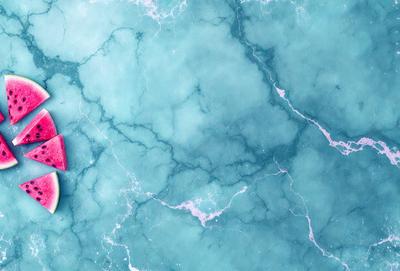 The primary subject of the image is a red object, possibly a toy or a piece of art, placed on a blue and white marbled surface. The setting appears to be a bathroom, as the marbled surface is a common feature in bathroom designs. The visual style of the image is a combination of photo and digital art, creating a unique and interesting appearance. The dominant colors in the image are blue and white, with the red object adding a pop of color to the scene. The overall atmosphere of the image is intriguing