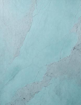 The primary subject of the image is a marble-like surface with a blue tint. The setting is a wall, and the visual style is a close-up of the surface. The colors and mood of the image are predominantly blue, giving it a calm and serene atmosphere.