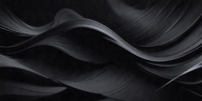 The primary subject of the image is a black and white photograph of a wave. The setting is a dark background, which contrasts with the wave's shape. The visual style is a black and white photo, giving it a classic and timeless appearance. The colors and mood of the image are predominantly dark, with the wave's shape being the main focus.