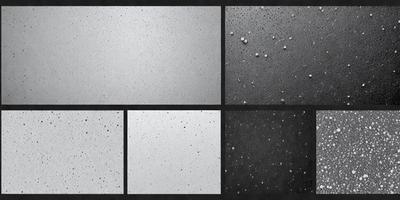 The primary subject of the image is a close-up of a white surface with black spots. The setting is a black and white photo, which gives it a classic and timeless appearance. The visual style is a black and white photo, which emphasizes the contrast between the white surface and the black spots. The colors and mood of the image are predominantly black and white, creating a sense of depth and contrast.