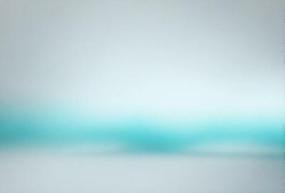 The primary subject of the image is a blue and white background. The setting is a white wall, and the visual style is a photo. The dominant colors are blue and white, creating a calm and serene atmosphere.