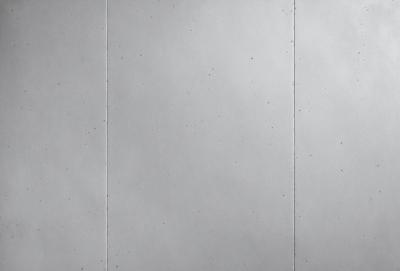 The image features a white wall with a pattern of dots on it. The wall appears to be made of a material that has a slightly textured surface. The dots are scattered across the wall, creating a visually interesting pattern. The overall atmosphere of the image is clean and minimalistic, with the focus on the white wall and the dots.