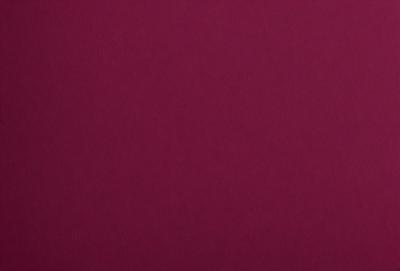 The primary subject of the image is a large, red sheet of paper. The setting is a wall, and the visual style is a close-up of the paper. The dominant colors are red and purple, creating a bold and striking appearance.