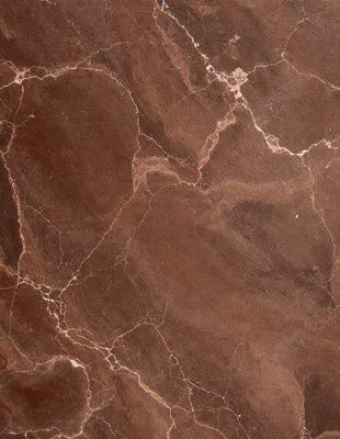 The image features a marble wall with a brown and red color scheme. The wall is covered in a pattern of circles, giving it a unique and intricate appearance. The setting appears to be a room with a focus on the marble wall, which serves as a striking visual element in the space. The visual style of the image is a close-up of the marble wall, highlighting its texture and pattern. The colors and mood of the image are warm and earthy, creating a sense of luxury and sophistication