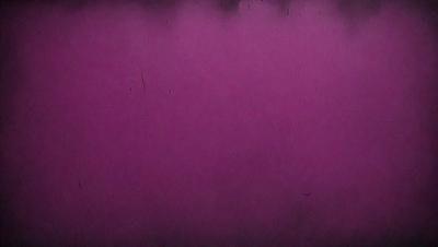 The primary subject of the image is a large, purple wall. The setting is a room with a purple background, and the visual style appears to be a photo. The dominant colors in the image are purple and pink, creating a warm and inviting atmosphere.